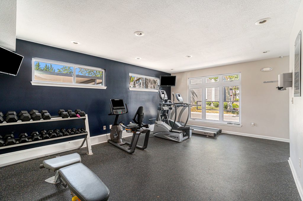 A luxurious shared amenity gym at Corinth Communities in Prairie Village Kansas.