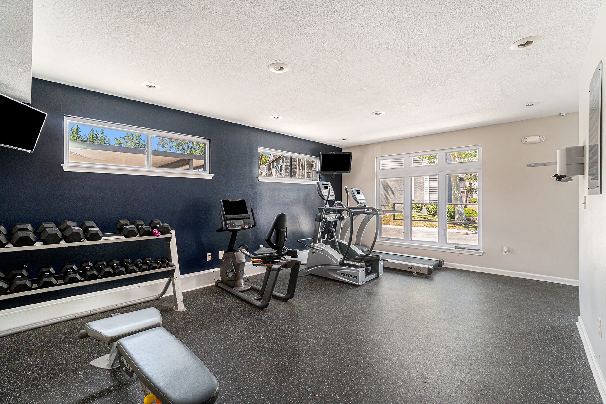 A luxurious shared amenity gym at Corinth Communities in Prairie Village Kansas.