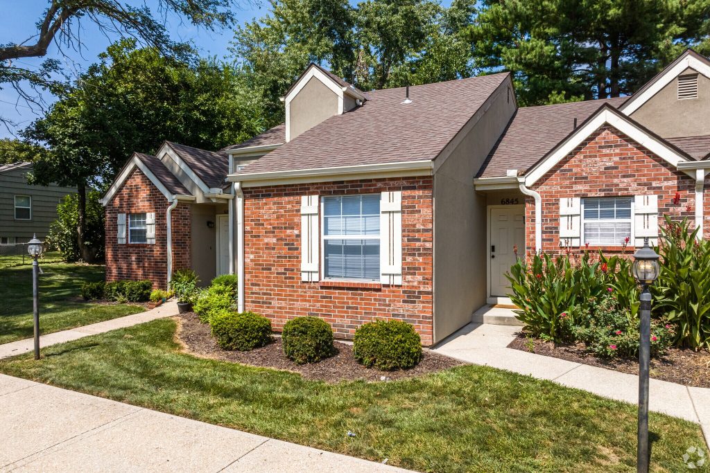 Photo of exterior of brick Corinth townhomes